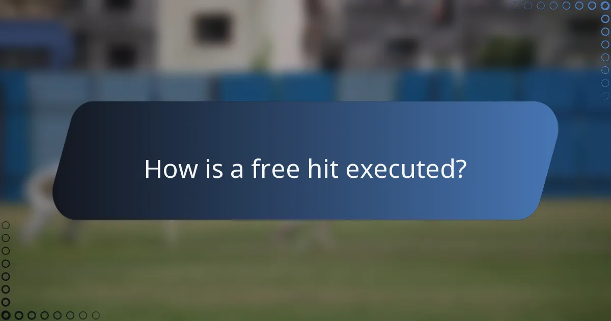 How is a free hit executed?